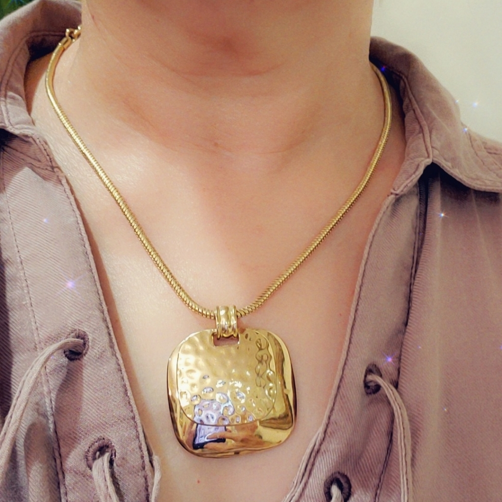 Beautiful golden necklace on the neck